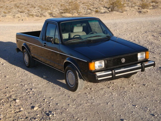 Black classic Volkswagen Caddy pickup