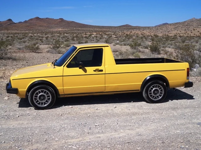 Yellow classic Volkswagen Caddy pickup